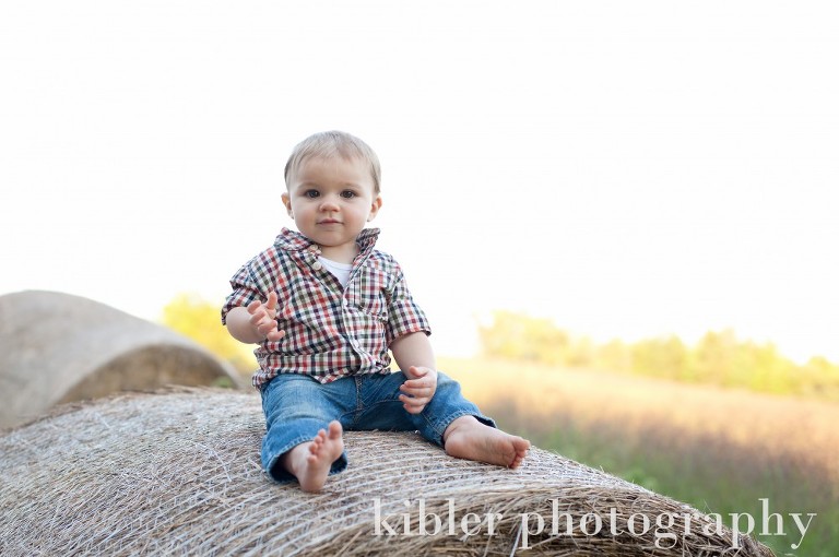 baby on hay bale