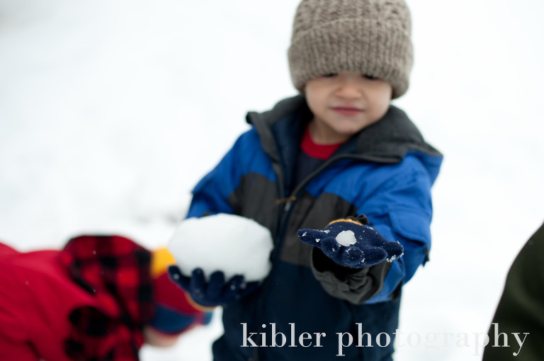 cute boy with baby snowball in his hand photo