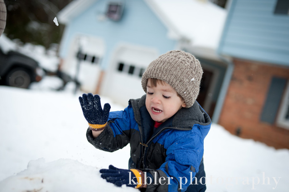 christian pounding the snow on the snow man photo