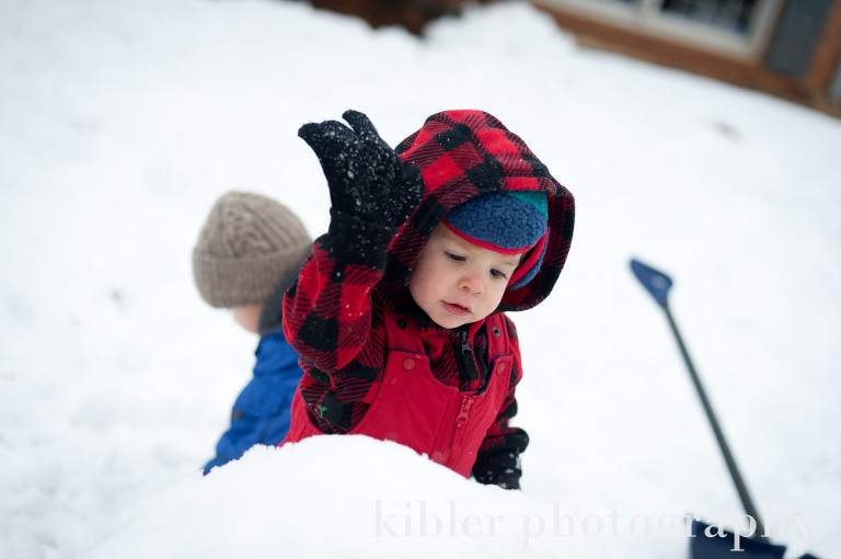 cute Jack pounding the snow on the snow man photo