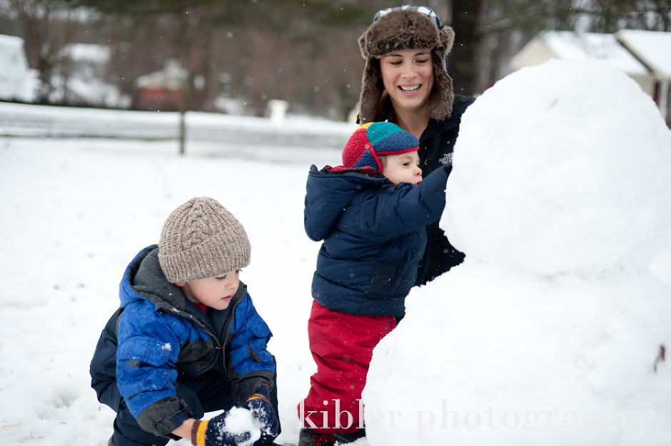 family making a cool snowman photo