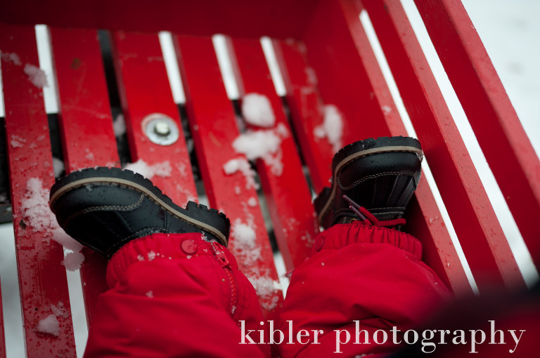 cute baby snow boots in red wagon photo