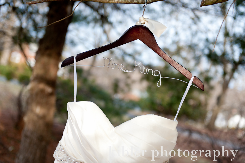 Kristen and Will elegant name on wedding dress hanger photo