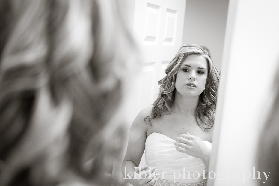 Kristen and Will bride looking in mirror photo