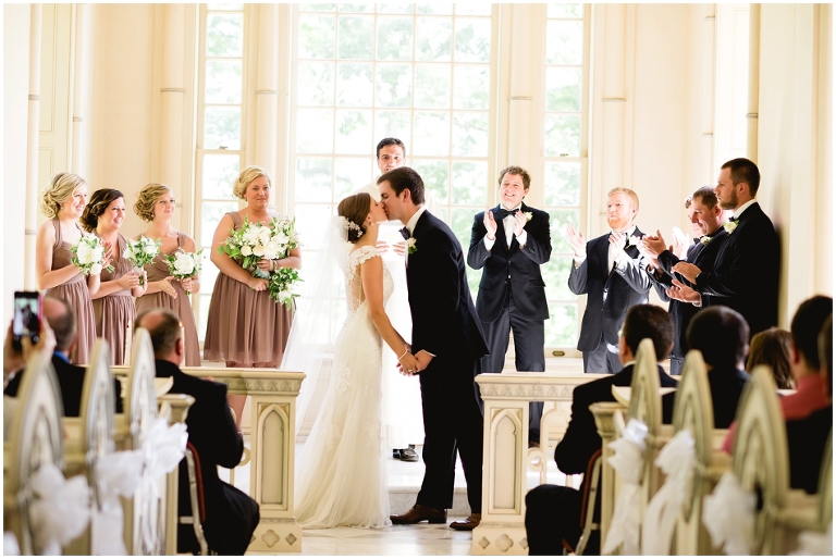 couple's first kiss as husband and wife at the Trump Winery Chapel- Kluge Chapel