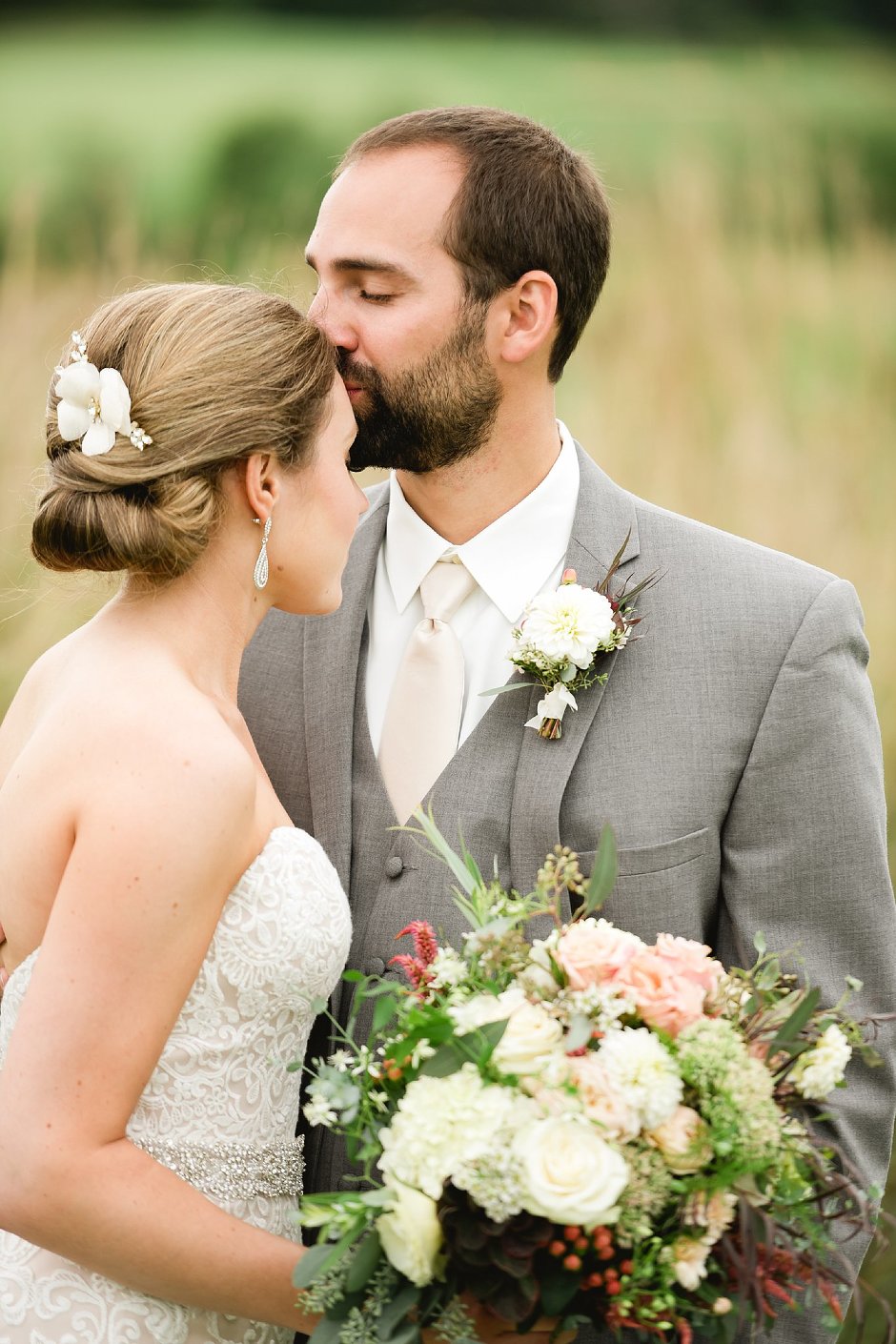 groom kisses bride 