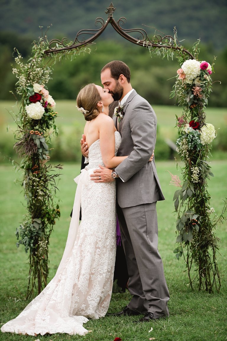 bride and grooms first kiss as husband and wife