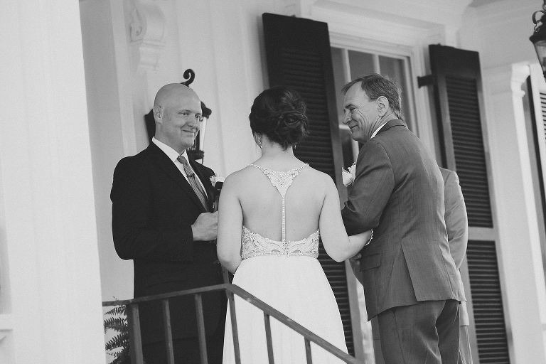 father giving bride away