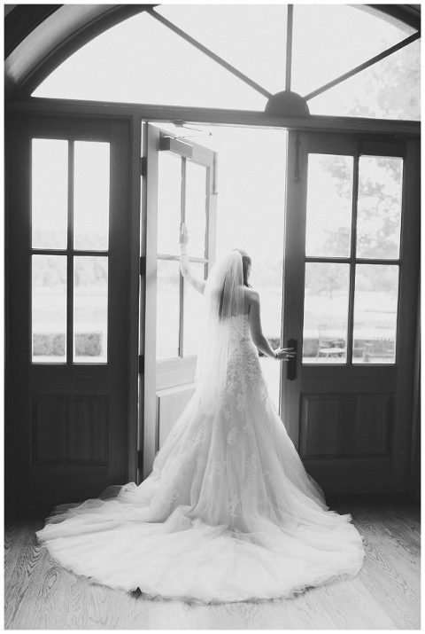 bridal portrait in doorway at Trump Winery barn