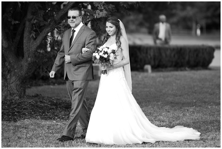 bride walking down the aisle with her father - Trump Winery wedding photographer