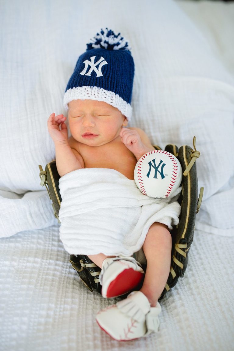 baby boy in baseball glove during virginia newborn portrait session