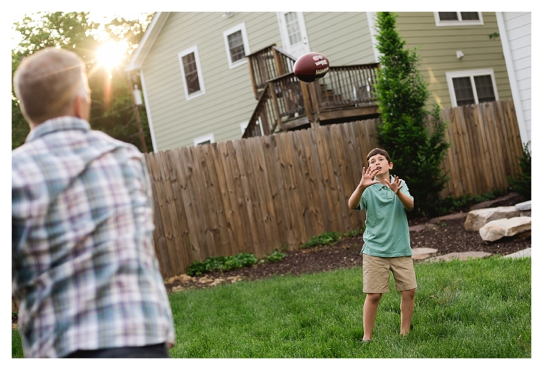 father and son playing football in Charlottesville Virginia