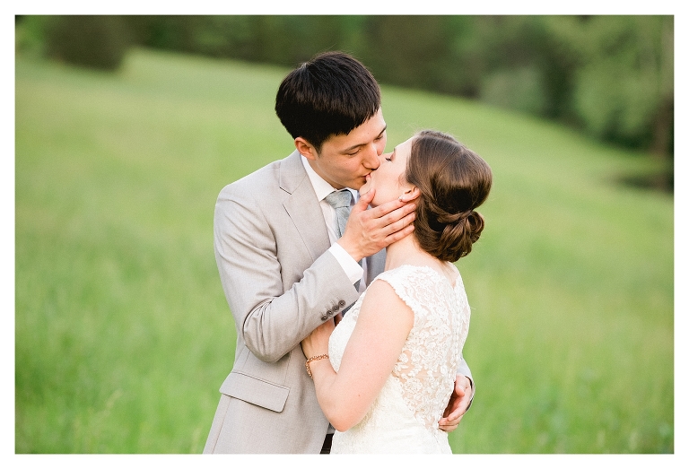 bride and groom kissing in a field - Central Virginia wedding