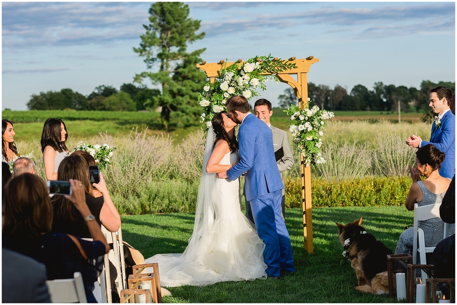 Kiss during Early Mountain Vineyard Wedding