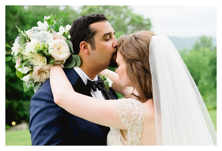 groom kissing his bride during their charlottesville va wedding
