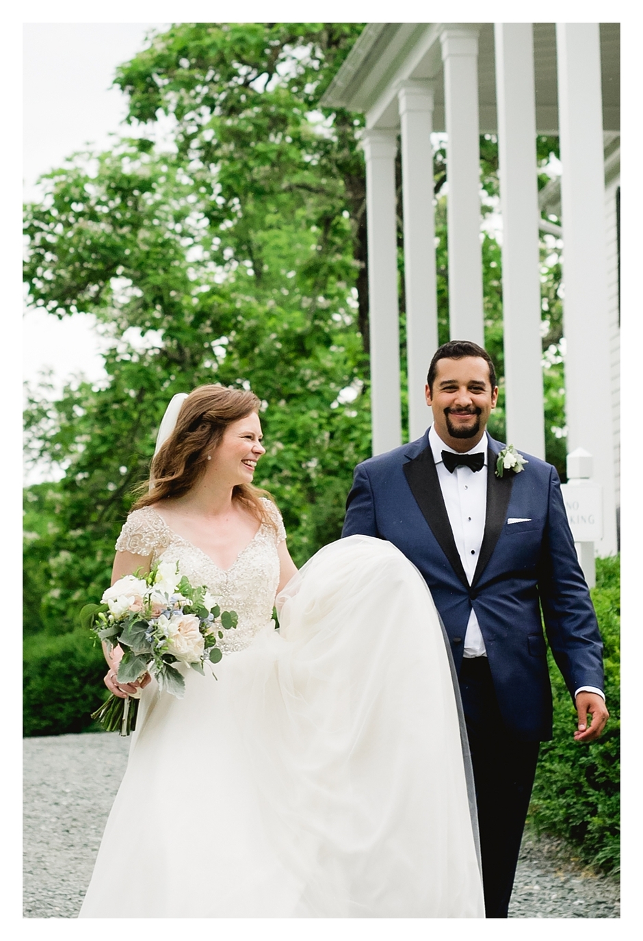 bride and groom walking down to their reception at clifton