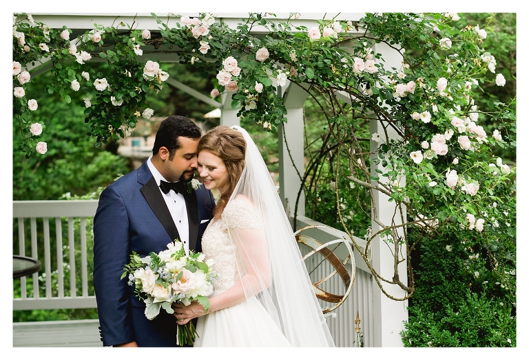 Clifton Inn Wedding couple under rose arbor