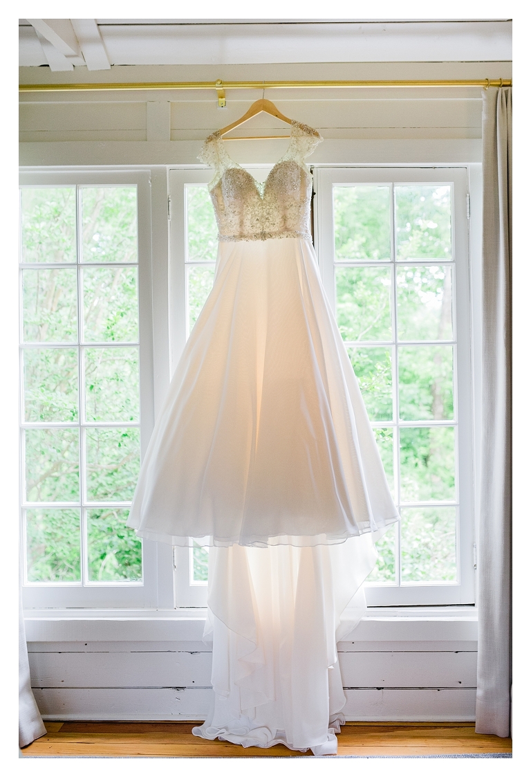 wedding dress hanging in the window and The Clifton Inn bridal suite