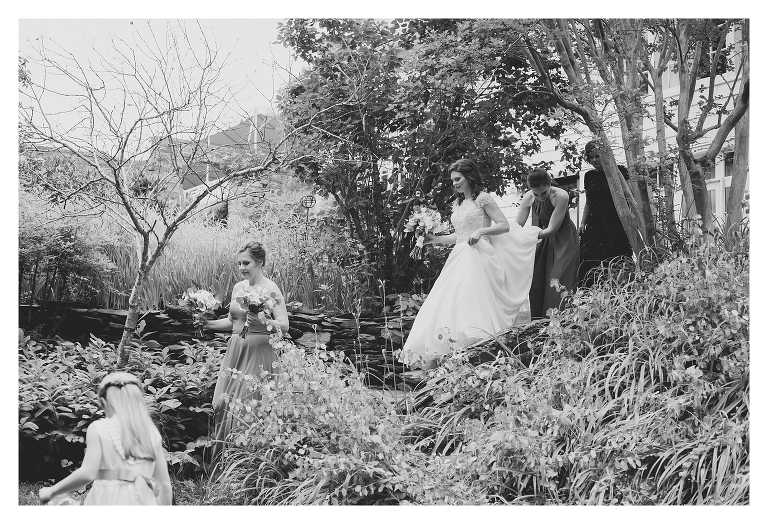 bride walking into the clifton inn garden before her wedding