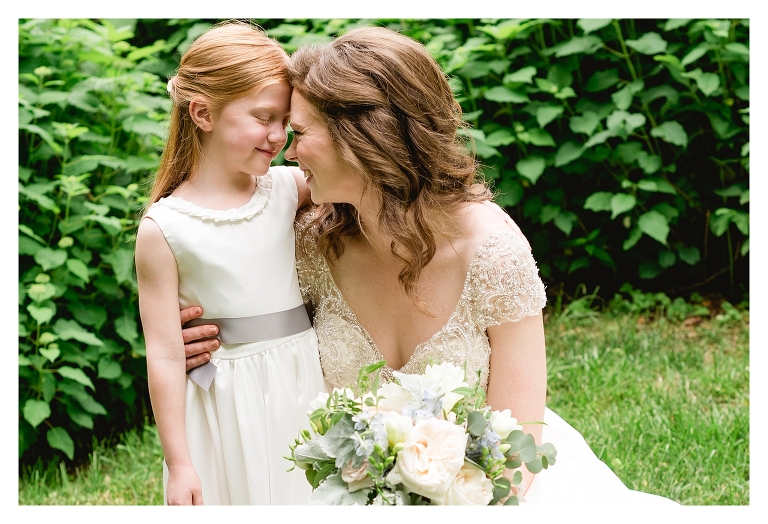 sweet moment of flower girl and bride 