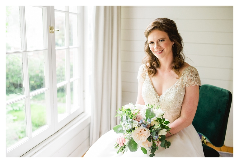 bridal portrait at clifton inn in front of the window