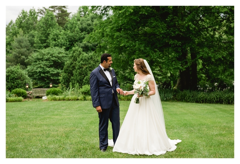 wedding couple holding hands by charlottesville wedding photographers