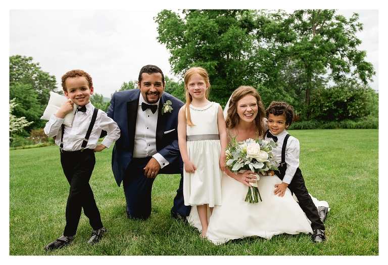 cute picture of bride and groom with wedding party during virginia wedding